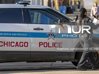 The Chicago Fire Department and Chicago Police Department respond to a structure fire at 1921 West Newport Avenue, in Chicago, IL, in the Ro...