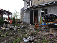 A hen is seen among the debris outside a building that has been damaged by a Russian missile attack in the Odesa region, southern Ukraine, o...