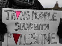 EDMONTON, CANADA - APRIL 21:
An activist holds a placard with words 'Trans People Stand With Palestine' as members of the Palestinian diaspo...