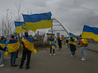 EDMONTON, CANADA - APRIL 21, 2024:
Members of the Ukrainian diaspora proudly wave national flags, hold blue and yellow balloons, and display...