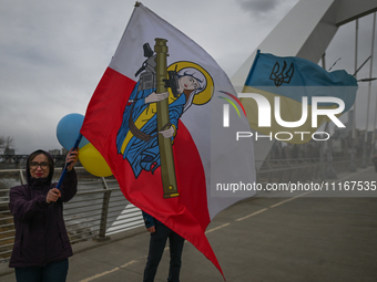 EDMONTON, CANADA - APRIL 21, 2024:
Members of the Ukrainian diaspora proudly wave national flags, hold blue and yellow balloons, and display...