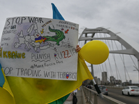 EDMONTON, CANADA - APRIL 21, 2024:
Members of the Ukrainian diaspora proudly wave national flags, hold blue and yellow balloons, and display...