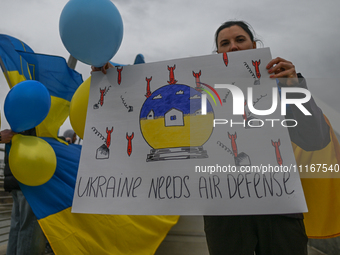 EDMONTON, CANADA - APRIL 21, 2024:
Members of the Ukrainian diaspora proudly wave national flags, hold blue and yellow balloons, and display...