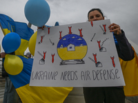 EDMONTON, CANADA - APRIL 21, 2024:
Members of the Ukrainian diaspora proudly wave national flags, hold blue and yellow balloons, and display...