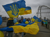 EDMONTON, CANADA - APRIL 21, 2024:
Members of the Ukrainian diaspora proudly wave national flags, hold blue and yellow balloons, and display...