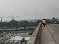 Smoke is emitting from the chimneys at a brick factory on the outskirts of Dhaka, Bangladesh, on April 22, 2024. These brick factories are c...