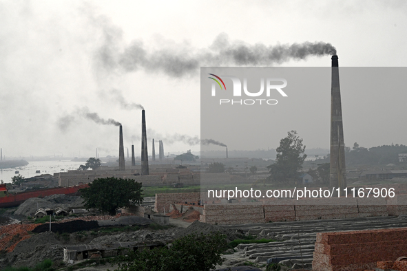 Smoke is emitting from the chimneys at a brick factory on the outskirts of Dhaka, Bangladesh, on April 22, 2024. These brick factories are c...