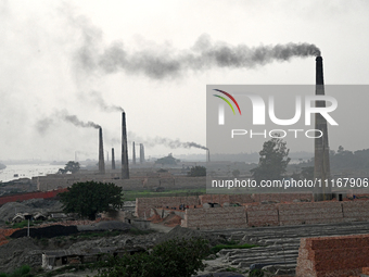 Smoke is emitting from the chimneys at a brick factory on the outskirts of Dhaka, Bangladesh, on April 22, 2024. These brick factories are c...