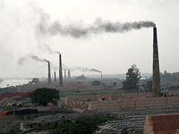 Smoke is emitting from the chimneys at a brick factory on the outskirts of Dhaka, Bangladesh, on April 22, 2024. These brick factories are c...