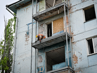 Workers are reconstructing a residential building damaged by a Russian missile strike on the night of March 2, 2023, at 67 Nezalezhnoyi Ukra...