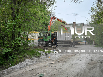 Workers are reconstructing a residential building damaged by a Russian missile strike on the night of March 2, 2023, at 67 Nezalezhnoyi Ukra...