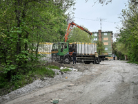 Workers are reconstructing a residential building damaged by a Russian missile strike on the night of March 2, 2023, at 67 Nezalezhnoyi Ukra...