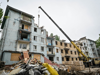 Workers are reconstructing a residential building damaged by a Russian missile strike on the night of March 2, 2023, at 67 Nezalezhnoyi Ukra...