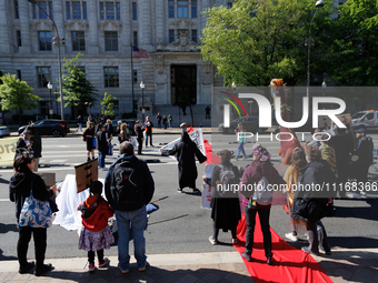 Climate activists with the Extinction Rebellion DC organization stage a protest outside of the John A. Wilson building in Washington, D.C. o...