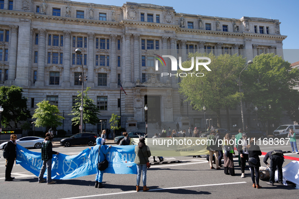 Climate activists with the Extinction Rebellion DC organization stage a protest outside of the John A. Wilson building in Washington, D.C. o...