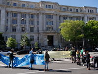 Climate activists with the Extinction Rebellion DC organization stage a protest outside of the John A. Wilson building in Washington, D.C. o...