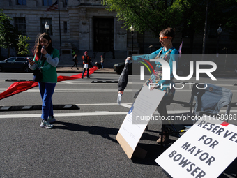 Climate activists with the Extinction Rebellion DC organization stage a protest outside of the John A. Wilson building in Washington, D.C. o...