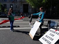 Climate activists with the Extinction Rebellion DC organization stage a protest outside of the John A. Wilson building in Washington, D.C. o...