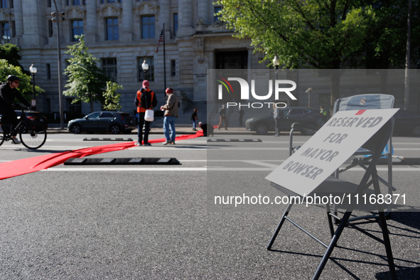 Climate activists with the Extinction Rebellion DC organization stage a protest outside of the John A. Wilson building in Washington, D.C. o...