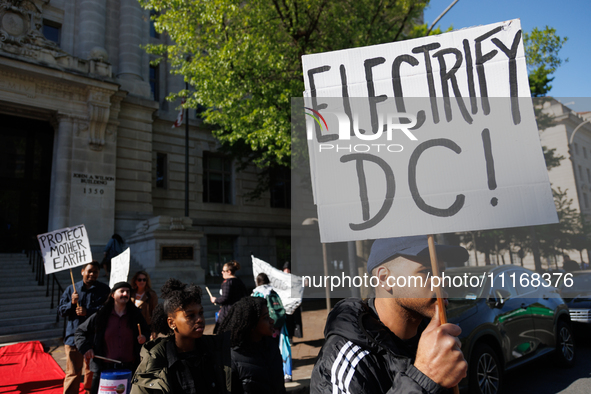 Climate activists with the Extinction Rebellion DC organization stage a protest outside of the John A. Wilson building in Washington, D.C. o...