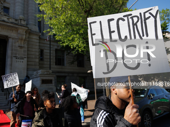 Climate activists with the Extinction Rebellion DC organization stage a protest outside of the John A. Wilson building in Washington, D.C. o...