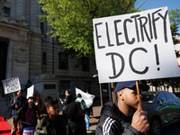 Climate activists with the Extinction Rebellion DC organization stage a protest outside of the John A. Wilson building in Washington, D.C. o...