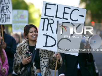 Climate activists with the Extinction Rebellion DC organization stage a protest outside of the John A. Wilson building in Washington, D.C. o...