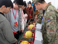 People are viewing naval equipment during the Open Ship Day in Shanghai, China, on April 23, 2024. (