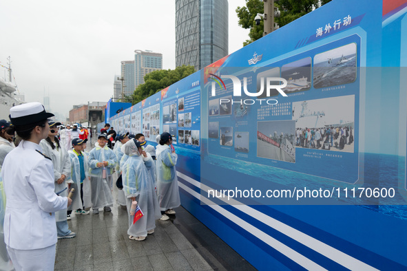 Children are learning naval knowledge during the Open Ship Day in Shanghai, China, on April 23, 2024. 