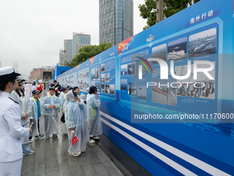 Children are learning naval knowledge during the Open Ship Day in Shanghai, China, on April 23, 2024. (