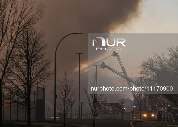 EDMONTON, CANADA - APRIL 22:
Emergency services at the scene as firefighters relentlessly combat flames that tore through Edmonton's histori...