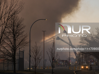 EDMONTON, CANADA - APRIL 22:
Emergency services at the scene as firefighters relentlessly combat flames that tore through Edmonton's histori...