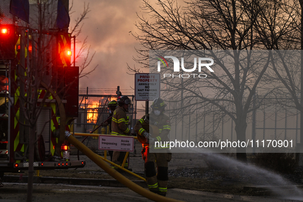 EDMONTON, CANADA - APRIL 22:
Firefighters relentlessly combat flames that tore through Edmonton's historic Hangar 11 on Monday evening, on A...