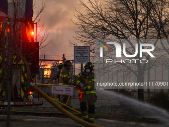 EDMONTON, CANADA - APRIL 22:
Firefighters relentlessly combat flames that tore through Edmonton's historic Hangar 11 on Monday evening, on A...