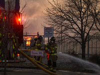 EDMONTON, CANADA - APRIL 22:
Firefighters relentlessly combat flames that tore through Edmonton's historic Hangar 11 on Monday evening, on A...