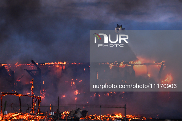 EDMONTON, CANADA - APRIL 22:
Firefighters relentlessly combat flames that tore through Edmonton's historic Hangar 11 on Monday evening, on A...