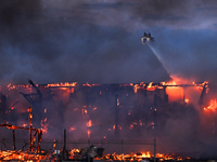 EDMONTON, CANADA - APRIL 22:
Firefighters relentlessly combat flames that tore through Edmonton's historic Hangar 11 on Monday evening, on A...