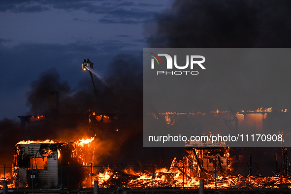 EDMONTON, CANADA - APRIL 22:
Firefighters relentlessly combat flames that tore through Edmonton's historic Hangar 11 on Monday evening, on A...