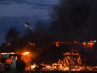 EDMONTON, CANADA - APRIL 22:
Firefighters relentlessly combat flames that tore through Edmonton's historic Hangar 11 on Monday evening, on A...