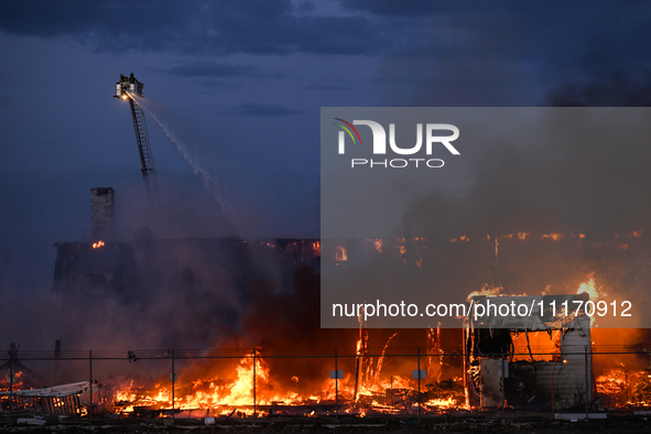 EDMONTON, CANADA - APRIL 22:
Several units of firefighters combat flames that tore through Edmonton's historic Hangar 11 on Monday evening,...