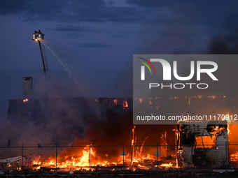 EDMONTON, CANADA - APRIL 22:
Several units of firefighters combat flames that tore through Edmonton's historic Hangar 11 on Monday evening,...