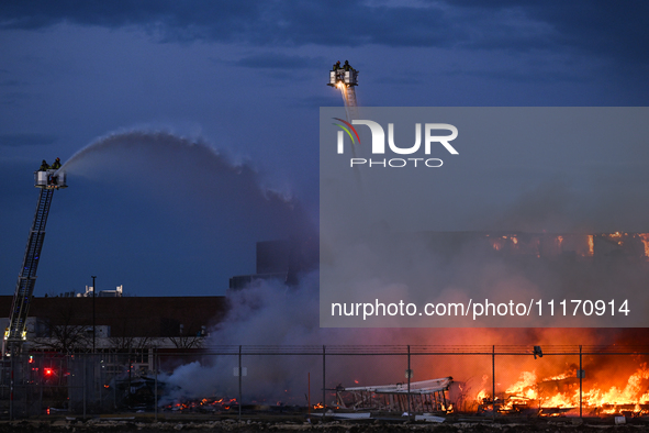 EDMONTON, CANADA - APRIL 22:
Several units of firefighters combat flames that tore through Edmonton's historic Hangar 11 on Monday evening,...