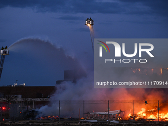 EDMONTON, CANADA - APRIL 22:
Several units of firefighters combat flames that tore through Edmonton's historic Hangar 11 on Monday evening,...