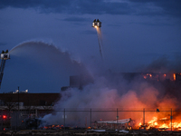 EDMONTON, CANADA - APRIL 22:
Several units of firefighters combat flames that tore through Edmonton's historic Hangar 11 on Monday evening,...