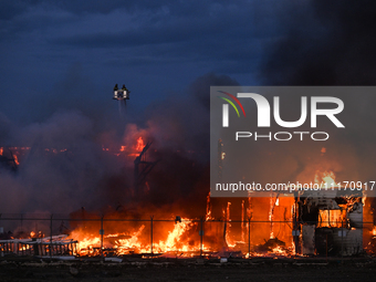 EDMONTON, CANADA - APRIL 22:
Firefighters combat flames that tore through Edmonton's historic Hangar 11 on Monday evening, on April 22, 2024...