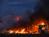 EDMONTON, CANADA - APRIL 22:
Firefighters combat flames that tore through Edmonton's historic Hangar 11 on Monday evening, on April 22, 2024...