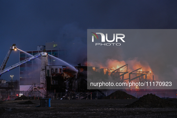 EDMONTON, CANADA - APRIL 22:
Several units of firefighters combat flames that tore through Edmonton's historic Hangar 11 on Monday evening,...