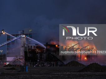 EDMONTON, CANADA - APRIL 22:
Several units of firefighters combat flames that tore through Edmonton's historic Hangar 11 on Monday evening,...