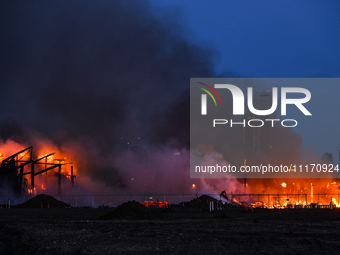 EDMONTON, CANADA - APRIL 22:
Several units of firefighters combat flames that tore through Edmonton's historic Hangar 11 on Monday evening,...