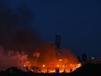 EDMONTON, CANADA - APRIL 22:
Locals approach the fire site, risking their health as several units of firefighters combat the flames that tor...